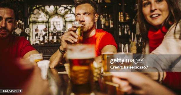 happy friends group drinking beer at brewery bar restaurant - friendship concept with young people enjoying time together and having genuine fun at cool vintage pub - bar berlin stock pictures, royalty-free photos & images