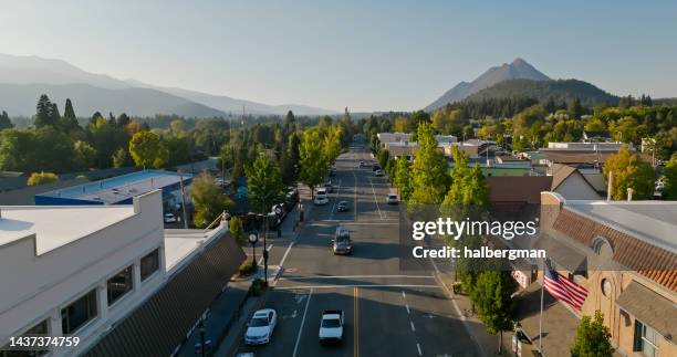 aerial view of street traffic in downtown mount shasta, california - small town stock pictures, royalty-free photos & images