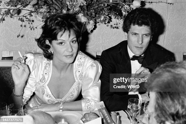 Manuela Papatakis and guest attend an event at Carpaccio, a restaurant in Paris, France, on April 25, 1985.