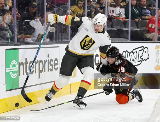 Nicolas Hague of the Vegas Golden Knights is held by Troy Terry of the Anaheim Ducks in the first period of their game at T-Mobile Arena on October...