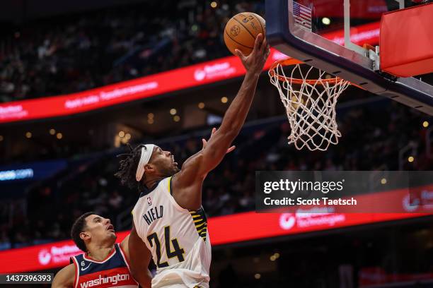 Buddy Hield of the Indiana Pacers goes to the basket against Johnny Davis of the Washington Wizards during the first half at Capital One Arena on...