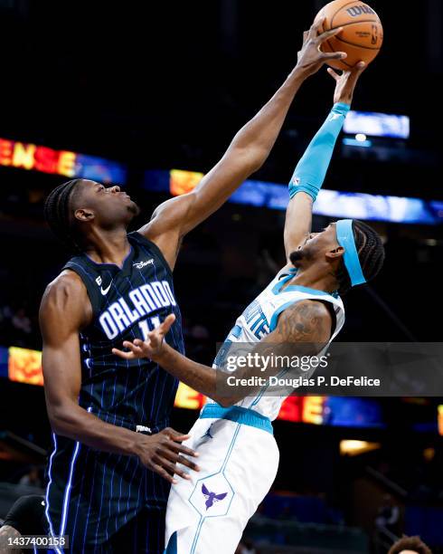 Mo Bamba of the Orlando Magic blocks a shot by Jalen McDaniels of the Charlotte Hornets during the third quarter at Amway Center on October 28, 2022...