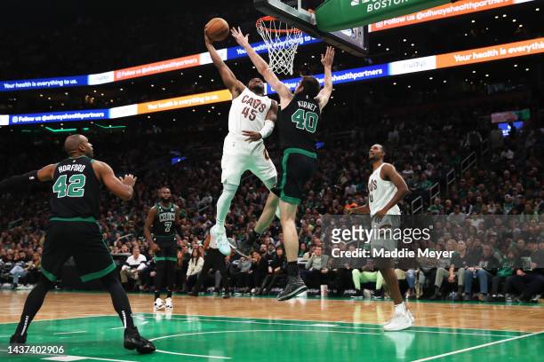 Donovan Mitchell of the Cleveland Cavaliers takes a shot against Luke Kornet of the Boston Celtics during the second half at TD Garden on October 28,...