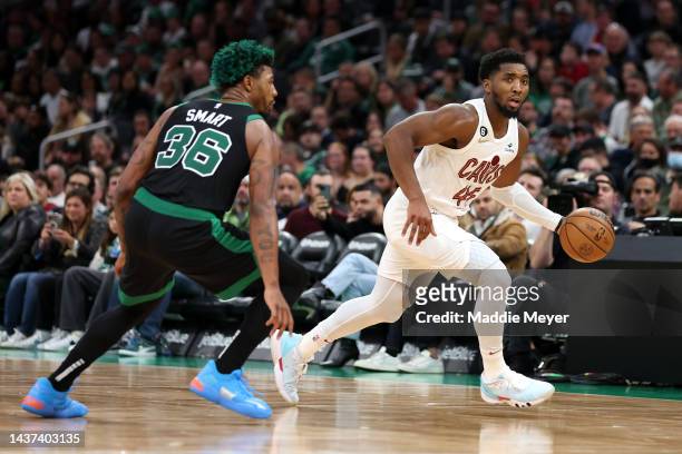 Marcus Smart of the Boston Celtics defends Donovan Mitchell of the Cleveland Cavaliers during the second half at TD Garden on October 28, 2022 in...