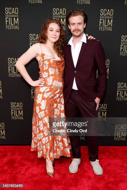 Austin Kirk and Kayli Carter pose on the red carpet during the 25th SCAD Savannah Film Festival on October 28, 2022 in Savannah, Georgia.