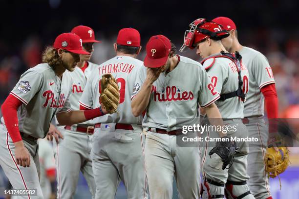 Aaron Nola of the Philadelphia Phillies walks off the field after being relieved in the fifth inning against the Houston Astros in Game One of the...