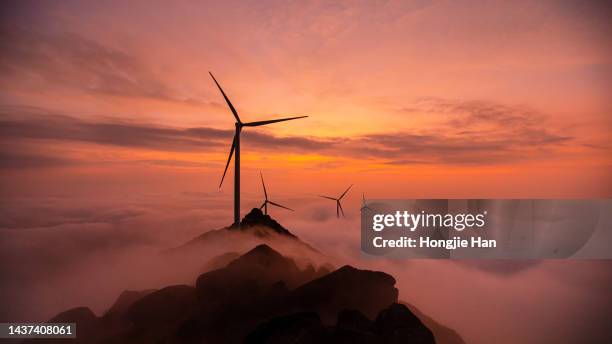 an electric windmill on the top of a hill, a clean renewable energy wind generator. - green technology stock pictures, royalty-free photos & images