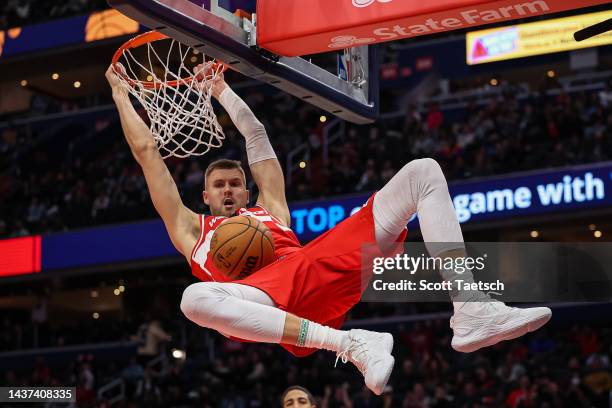 Kristaps Porzingis of the Washington Wizards dunks the ball against the Indiana Pacers during the second half at Capital One Arena on October 28,...