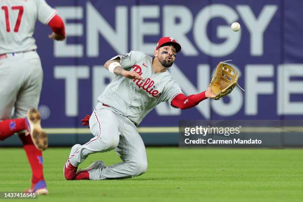 Nick Castellanos of the Philadelphia Phillies slides to catch a fly ball in the ninth inning against the Houston Astros in Game One of the 2022 World...