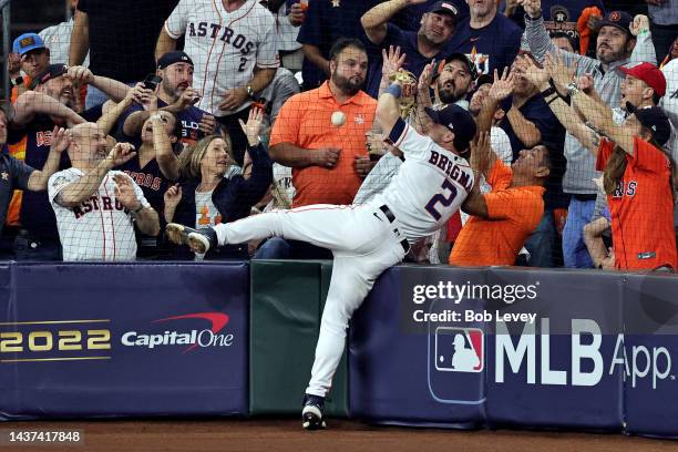 Alex Bregman of the Houston Astros attempts to catch a foul ball in the 10th inning against the Philadelphia Phillies in Game One of the 2022 World...