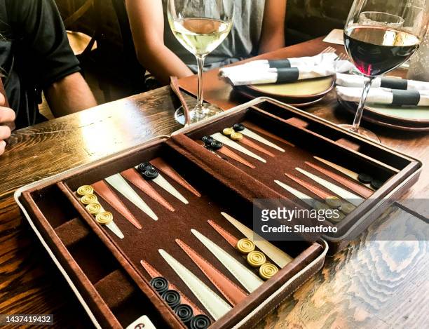 backgammon set on restaurant table - backgammon ストックフォトと画像