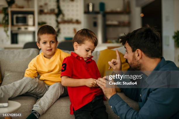 you can't behave like that to your brother - stubborn stock pictures, royalty-free photos & images