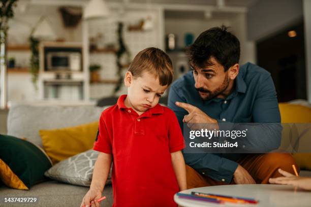 parent disciplining and talking to his boy - punishment stock pictures, royalty-free photos & images