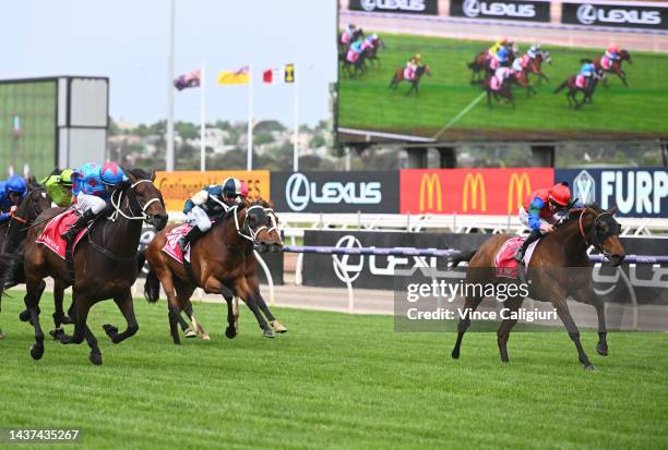 Michael Dee riding Manzoice defeats James McDonald riding Sharp'n'Smart in Race 7, the Penfolds Victoria Derby, during 2022 Penfolds Victoria Derby...