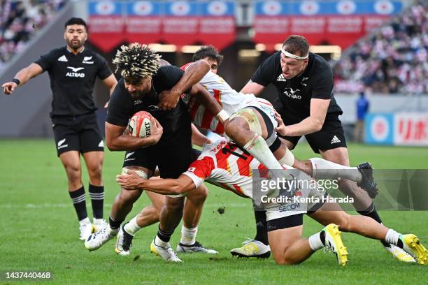 Hoskins Sotutu of New Zealand is tackled during the international test match between Japan and New Zealand All Blacks at National Stadium on October...