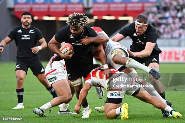 Hoskins Sotutu of New Zealand is tackled during the international test match between Japan and New Zealand All Blacks at National Stadium on October...