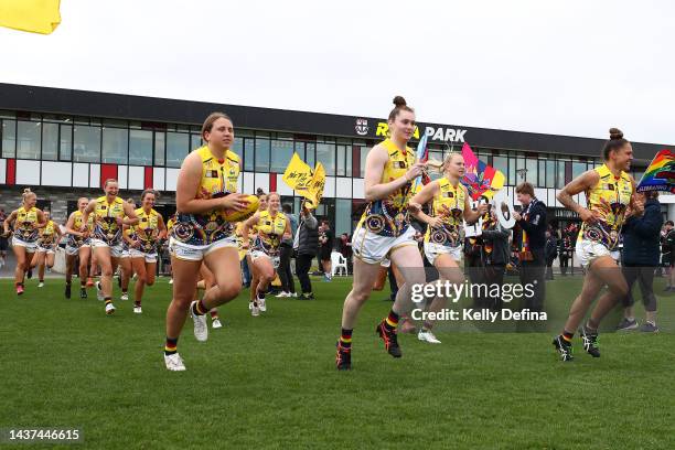 Crows run out during the round 10 AFLW match between the St Kilda Saints and the Adelaide Crows at RSEA Park on October 29, 2022 in Melbourne,...