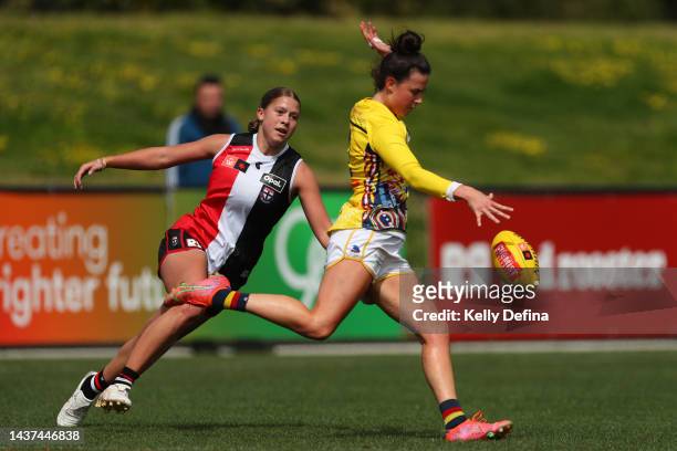 Eloise Jones of the Crows kicks the ball under pressure from J'Noemi Anderson of the Saints during the round 10 AFLW match between the St Kilda...