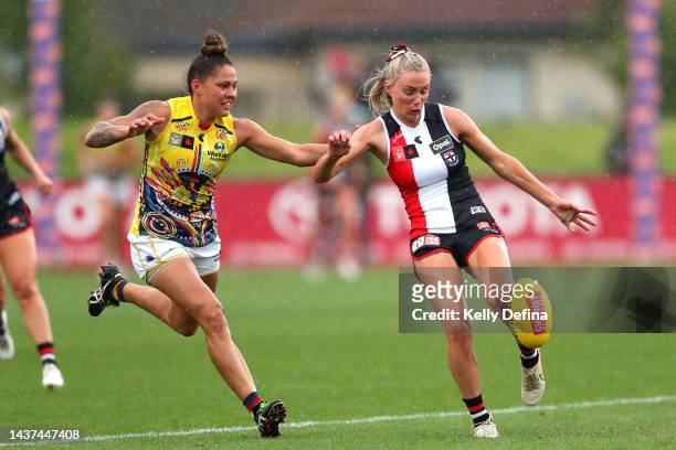 Stevie-Lee Thompson of the Crows applies defensive pressure during the round 10 AFLW match between the St Kilda Saints and the Adelaide Crows at RSEA...