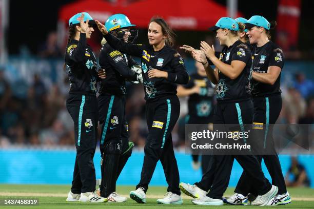 Amelia Kerr of the celebrates after dismissing Beth Mooney of the Scorchers during the Women's Big Bash League match between the Brisbane Heat and...
