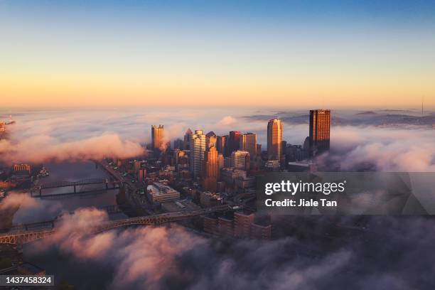 high angle view of chicago city skyline at dusk - chicago stock-fotos und bilder