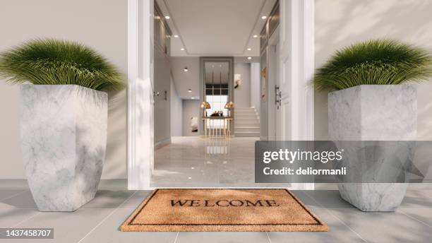 testo di benvenuto sullo zerbino - zerbino foto e immagini stock