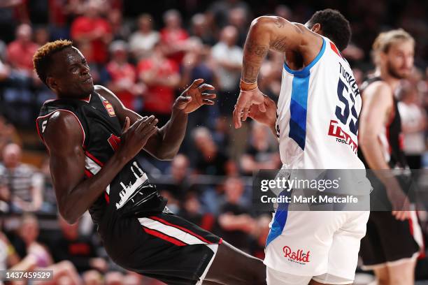 Rayjon Tucker of United pushes Deng Deng of the Hawks during the round five NBL match between Illawarra Hawks and Melbourne United at WIN...