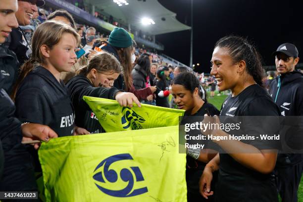Ruahei Denant of New Zealand celebrates with fans after the Rugby World Cup 2021 Quarterfinal match between New Zealand and Wales at Northland Events...