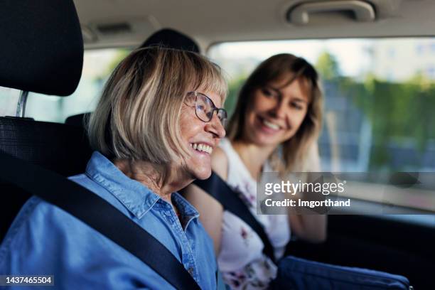 senior woman and her daughter on road trip - selective focus imagens e fotografias de stock