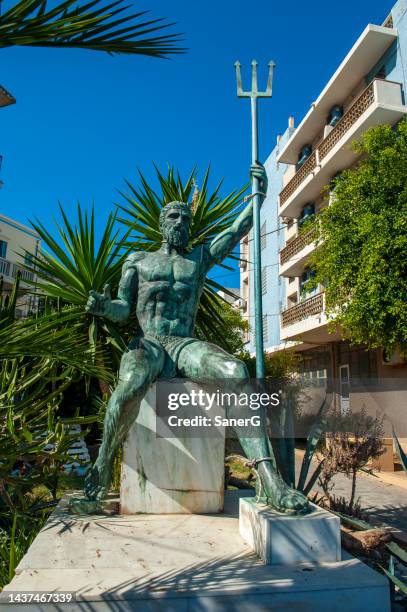 kalymnos island at dodecanese in greece. statue of poseidon - poseidon sculpture stock pictures, royalty-free photos & images