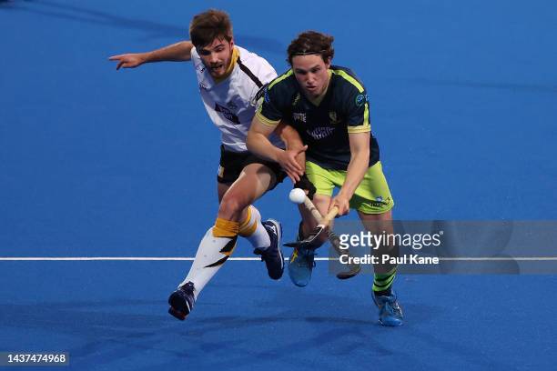 Jospeh Murphy of the Tigers controls the ball against Bryn De Bes of the Thundersticks during the round five Hockey One League match between Perth...