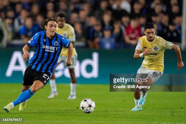 Stephen Eustaqulo of FC Porto battles for the ball with Casper Nielsen of Club Brugge KV during the Group B - UEFA Champions League match between...