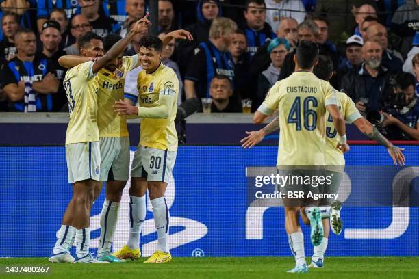 Mehdi Taremi of FC Porto celebrates with Galeno of FC Porto and Evan Evanilson of FC Porto after scoring his sides first goal during the Group B -...