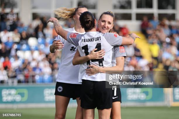 Geraldine Reutelerof Frankfurt celebrates the second goal with Lara Prasnikar andf Laura Freigang of Frankfurt during the FLYERALRM Frauen-Bundesliga...