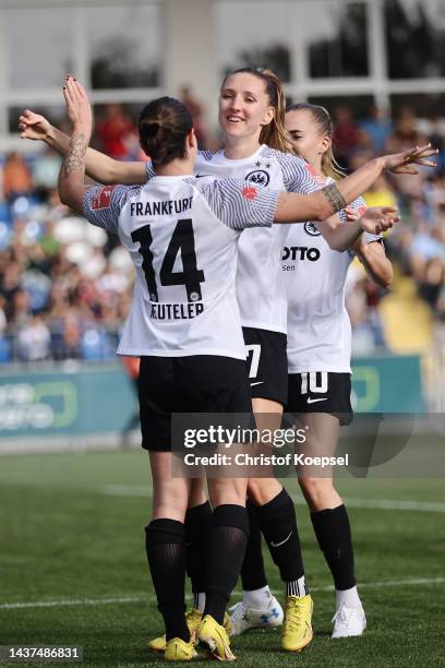 Geraldine Reutelerof Frankfurt celebrates the second goal with Lara Prasnikar andf Laura Freigang of Frankfurt during the FLYERALRM Frauen-Bundesliga...