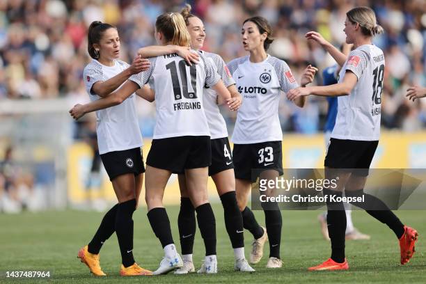 Laura Freigang of Frankfurt celebrates the third goal withg Sophia Kleinherne and other team mates during the FLYERALRM Frauen-Bundesliga match...