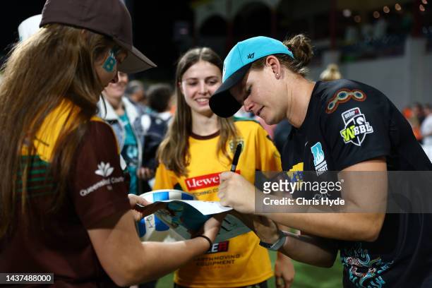 Jess Jonassen of the Heat with fans during the Women's Big Bash League match between the Brisbane Heat and the Perth Scorchers at Allan Border Field,...