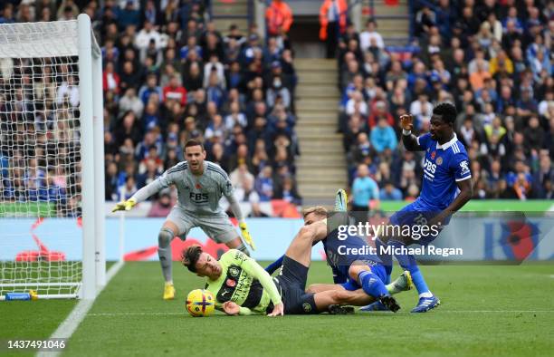 Jack Grealish of Manchester City is challenged by Kiernan Dewsbury-Hall of Leicester City during the Premier League match between Leicester City and...