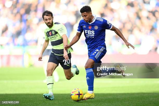 James Justin of Leicester City is challenged by Bernardo Silva of Manchester City during the Premier League match between Leicester City and...