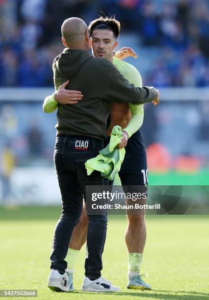 Pep Guardiola celebrates with Jack Grealish of Manchester City after their sides victory during the Premier League match between Leicester City and...
