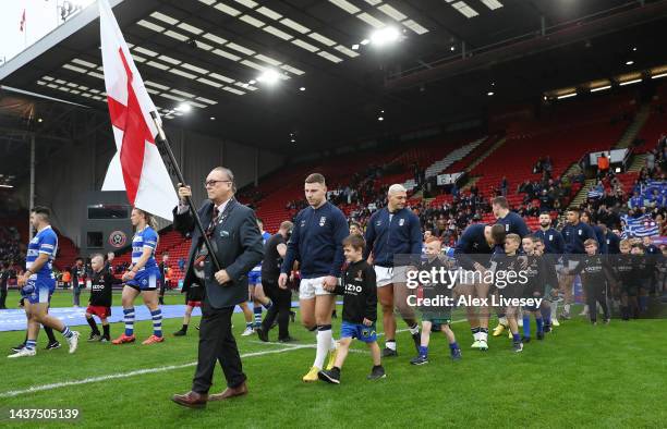 Players of England and Greece make their way out for the National Anthems ahead of the Rugby League World Cup 2021 Pool A match between England and...