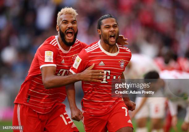 Serge Gnabry celebrates with Eric Maxim Choupo-Moting of Bayern Munich after scoring their team's first goalduring the Bundesliga match between FC...