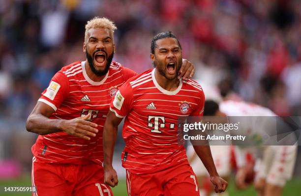 Serge Gnabry celebrates with Eric Maxim Choupo-Moting of Bayern Munich after scoring their team's first goal during the Bundesliga match between FC...