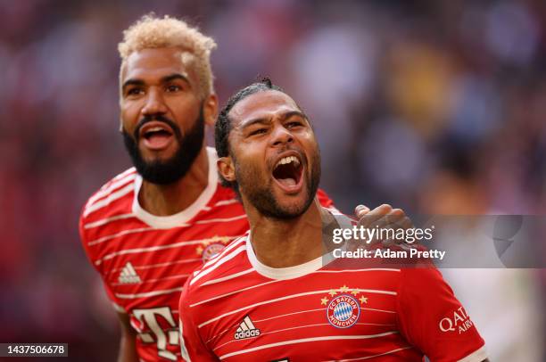 Serge Gnabry celebrates with Eric Maxim Choupo-Moting of Bayern Munich after scoring their team's first goal during the Bundesliga match between FC...