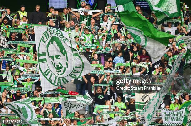 Fans show their support from the stands during the Bundesliga match between VfL Wolfsburg and VfL Bochum 1848 at Volkswagen Arena on October 29, 2022...