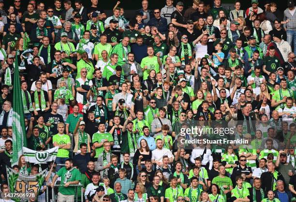 Fans show their support from the stands during the Bundesliga match between VfL Wolfsburg and VfL Bochum 1848 at Volkswagen Arena on October 29, 2022...