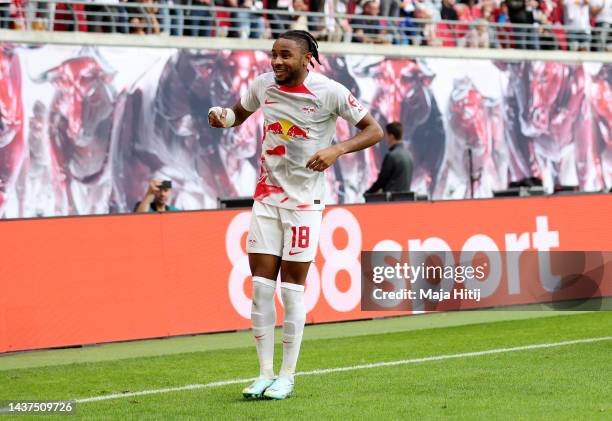 Christopher Nkunku of RB Leipzig celebrates after scoring their team's first goal during the Bundesliga match between RB Leipzig and Bayer 04...