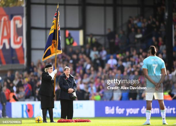 Members of the British Armed Forces participate in a ceremony in honour of Armistice Day prior to the Premier League match between Crystal Palace and...
