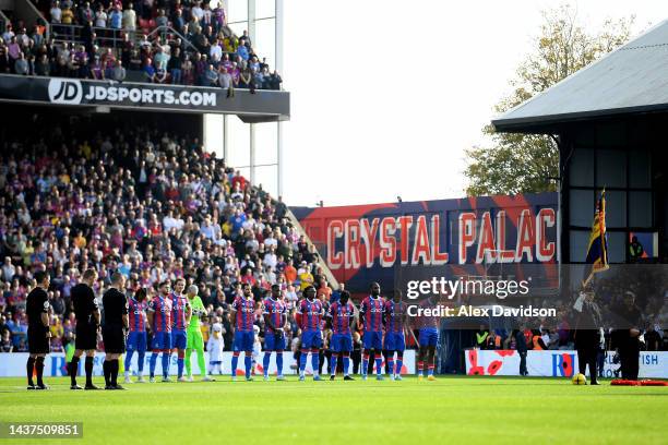Players, staff and members of the British Armed Forces participate in a minute silence in honour of Armistice Day prior to during the Premier League...