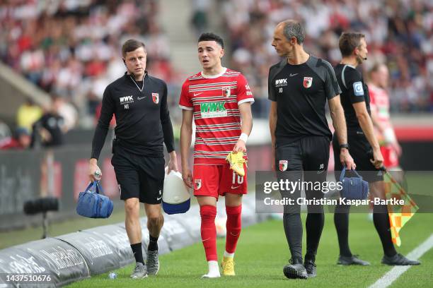 Ruben Vargas of Augsburg walks off with an injury during the Bundesliga match between VfB Stuttgart and FC Augsburg at Mercedes-Benz Arena on October...